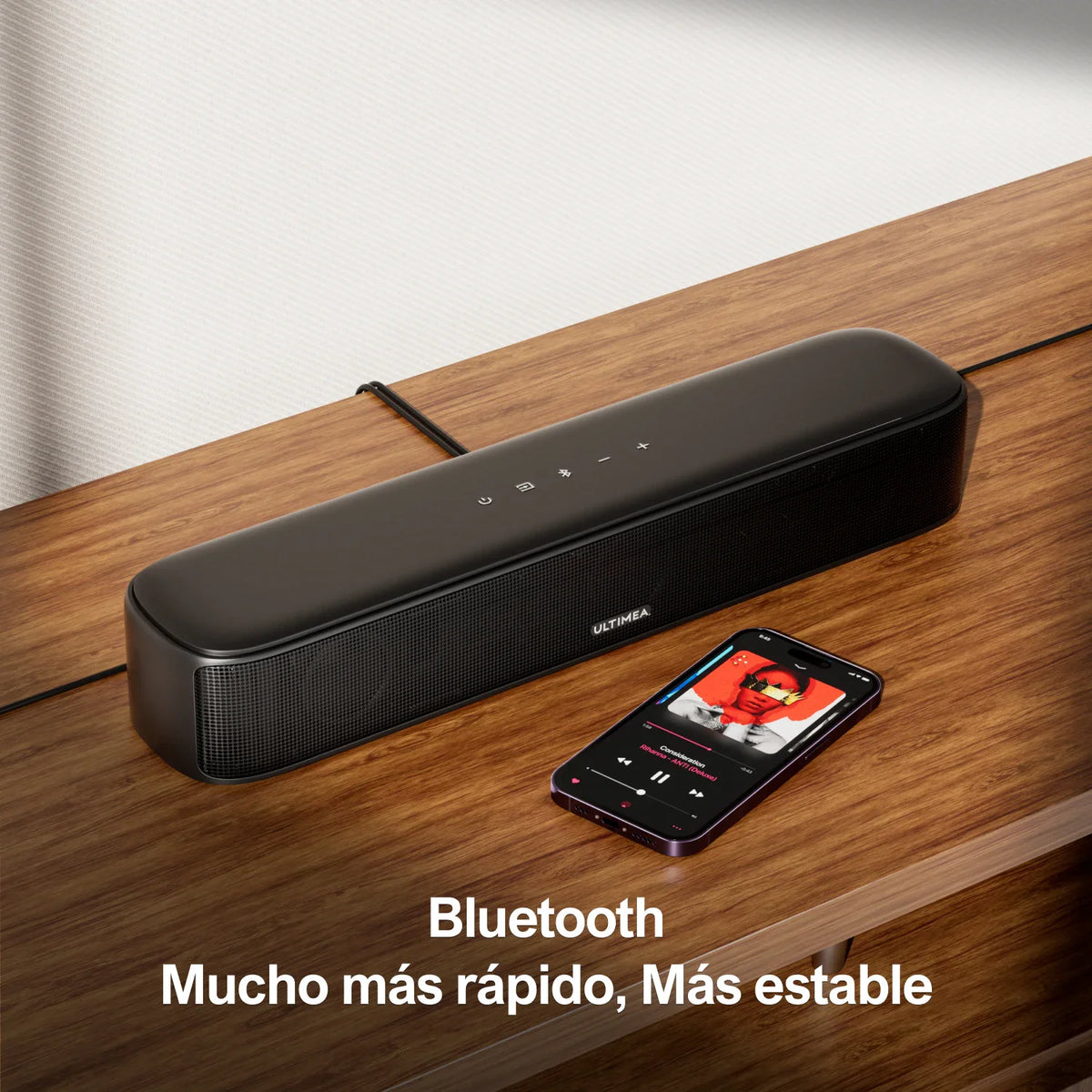 Soundbar with mobile phone connected via Bluetooth, displaying a music player interface