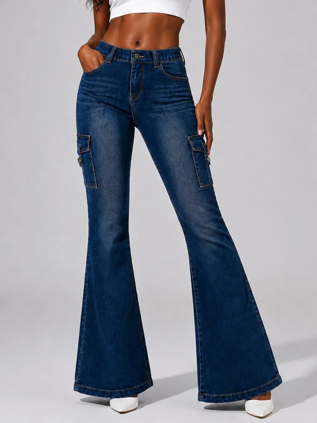 Dark wash blue cargo flare jeans worn by a model.