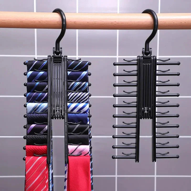 A black multi-tier tie rack holding various colorful neckties, shown hanging on a rod.