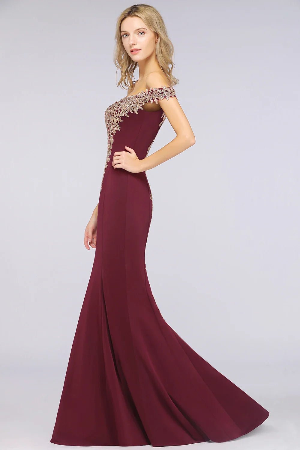 Side view of a elegant burgundy mermaid evening gown