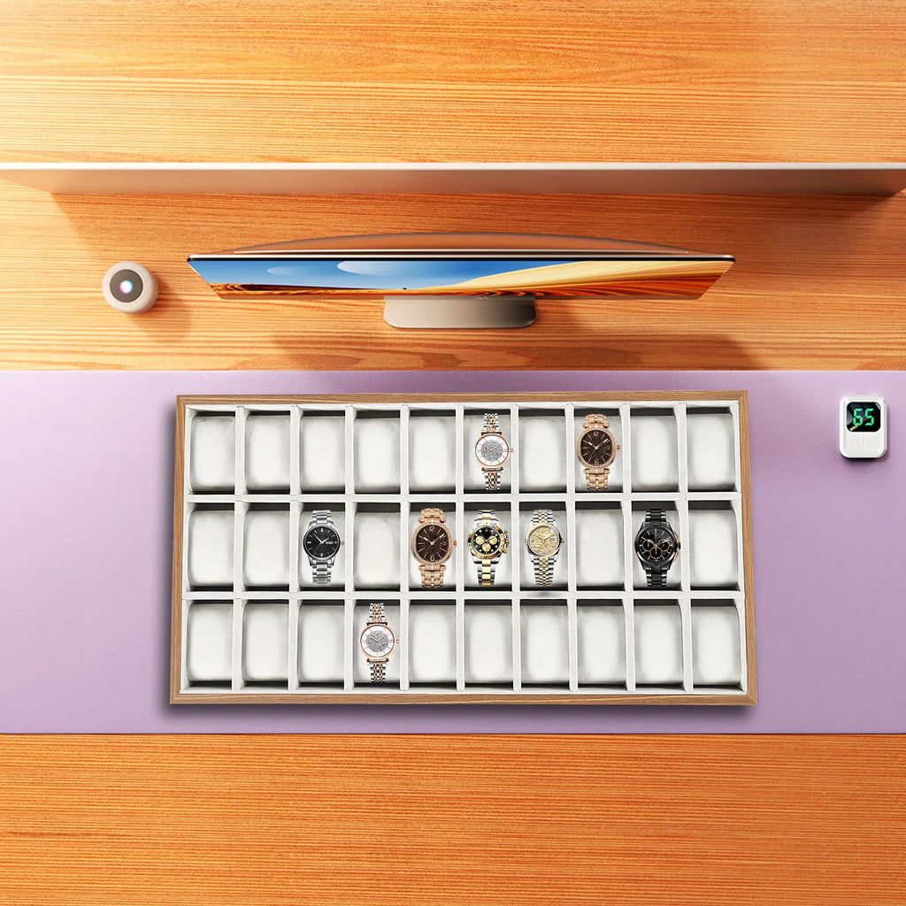30-slot wooden watch display tray on desk with monitor and accessories