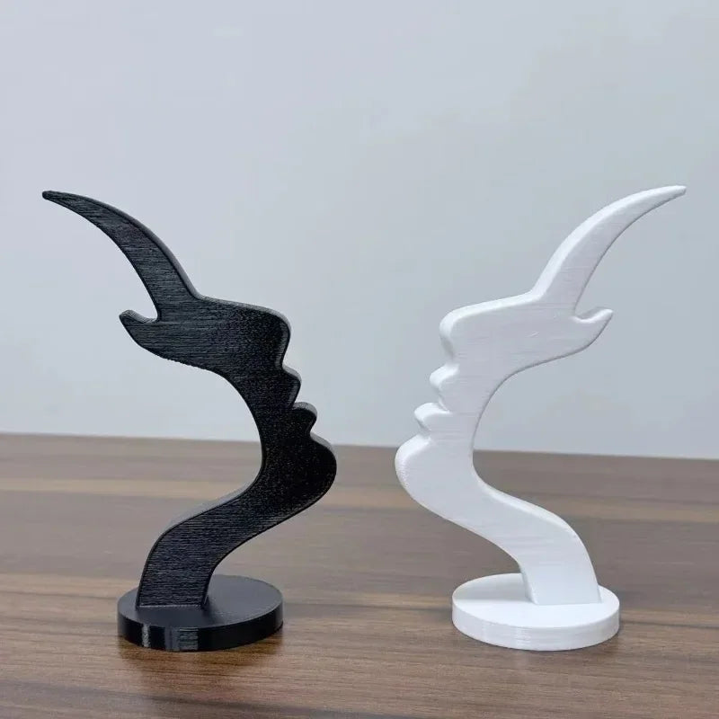 Black and white abstract profile sculpture face stands for holding glasses