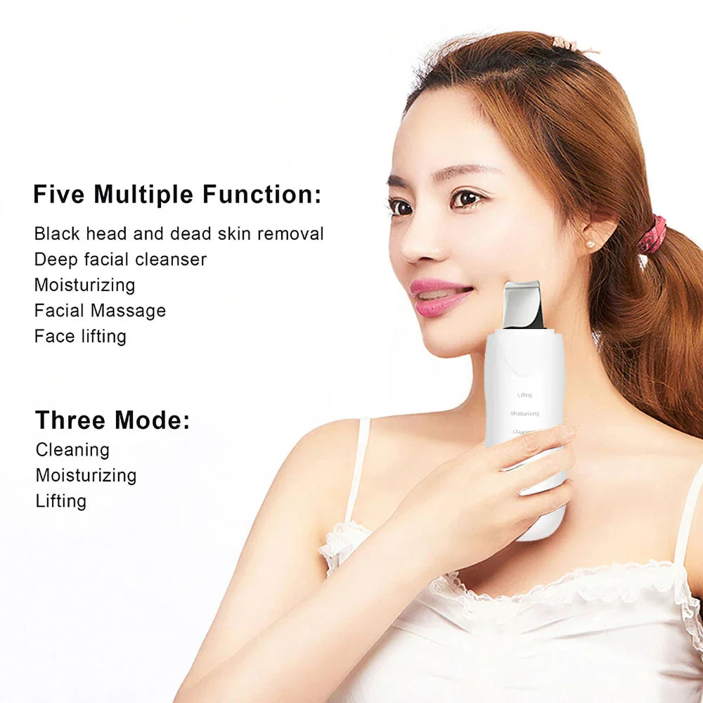 Woman holding a white ultrasonic facial skin scrubber and massage device