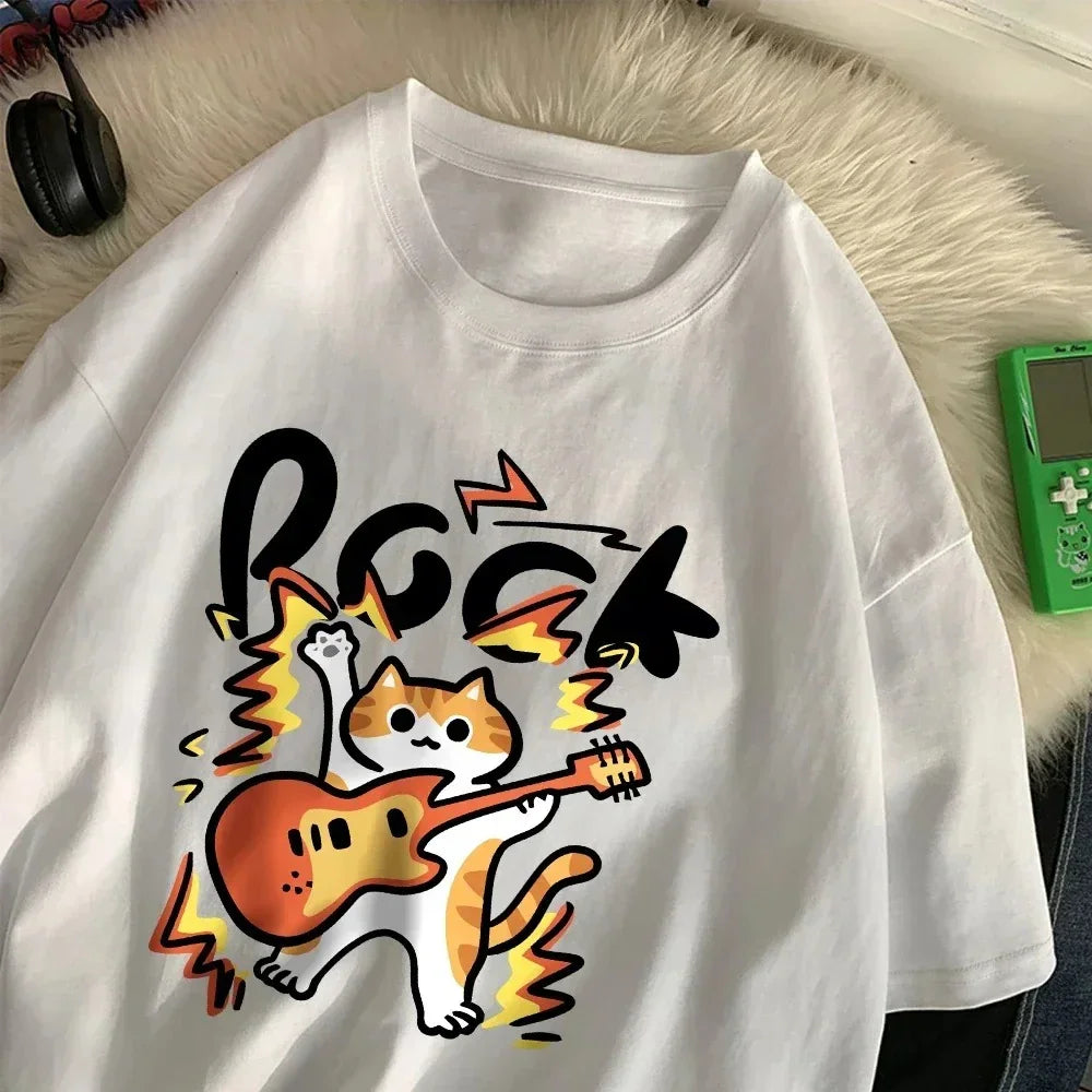 White oversized t-shirt with a cartoon cat playing an electric guitar graphic