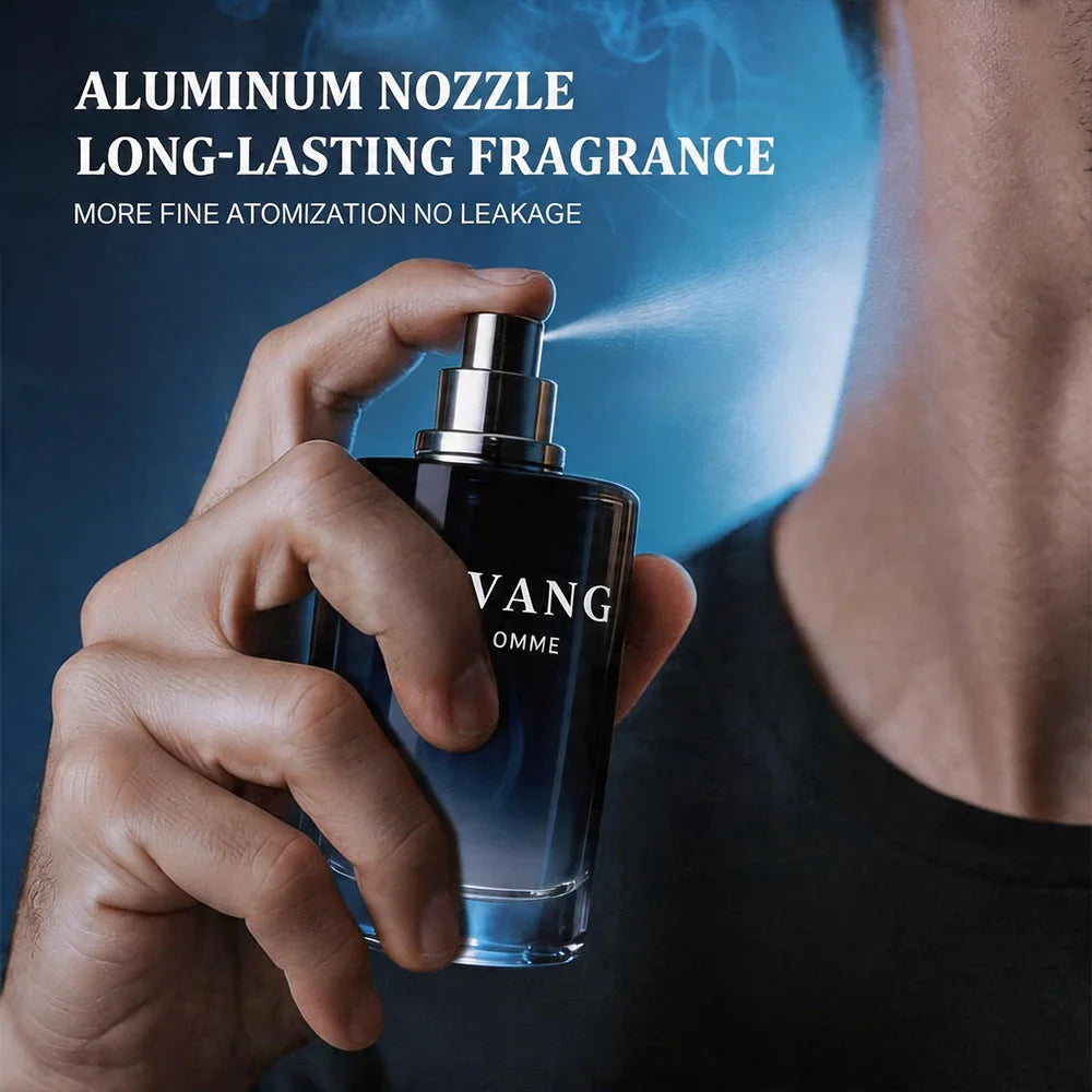A man spraying a dark blue glass bottle of perfume on his neck