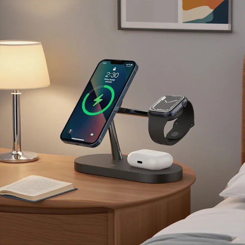 A black 3-in-1 magnetic wireless charging station on a nightstand with a phone, watch, and earbuds.