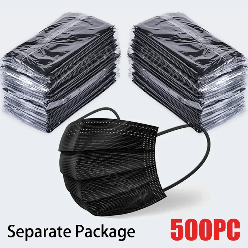 A stack of individually wrapped black 3-layer disposable face masks