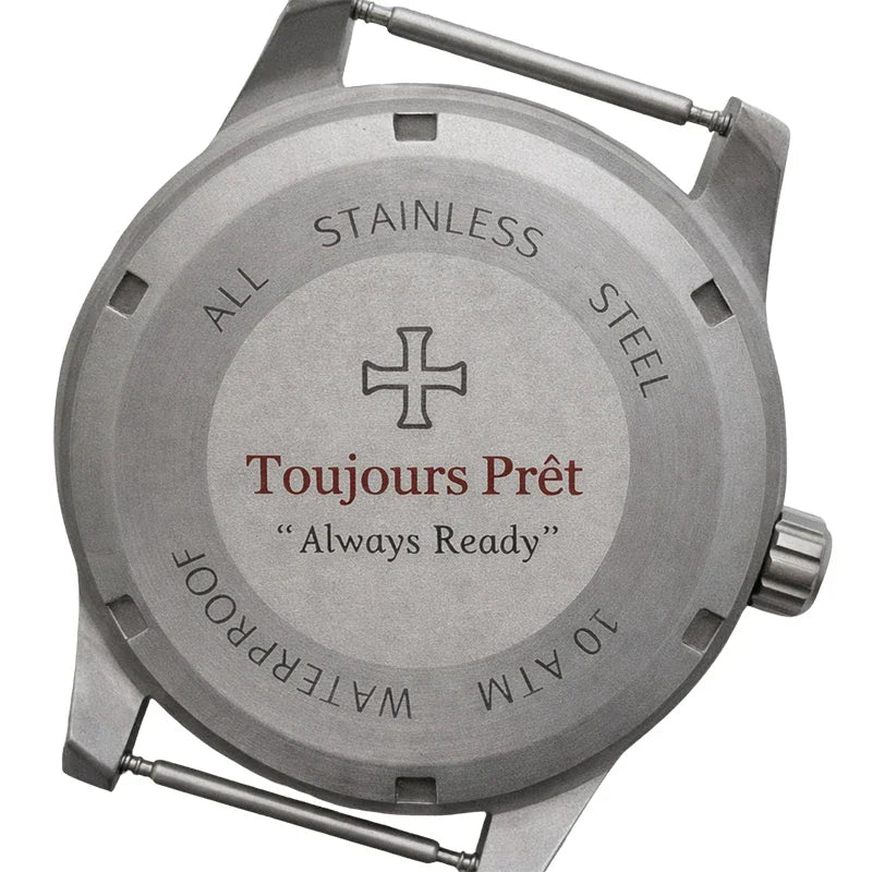 Stainless steel watch case back engraved with the text Toujours Prêt and Always Ready