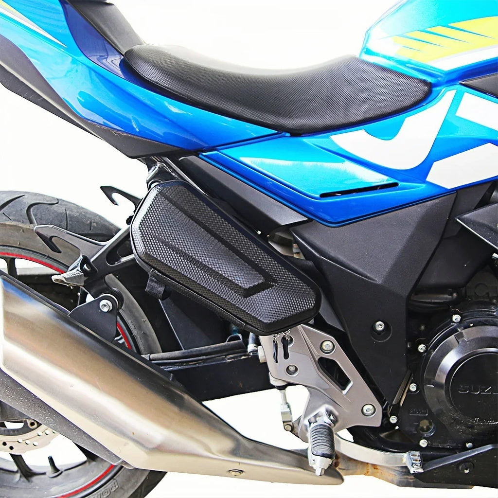 Side view of a compact black waterproof motorcycle bag attached to a sport bike