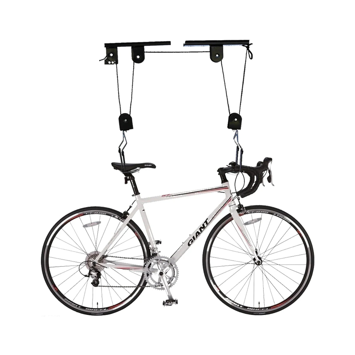 A white road bicycle suspended by a pulley ceiling hoist system on a white background.