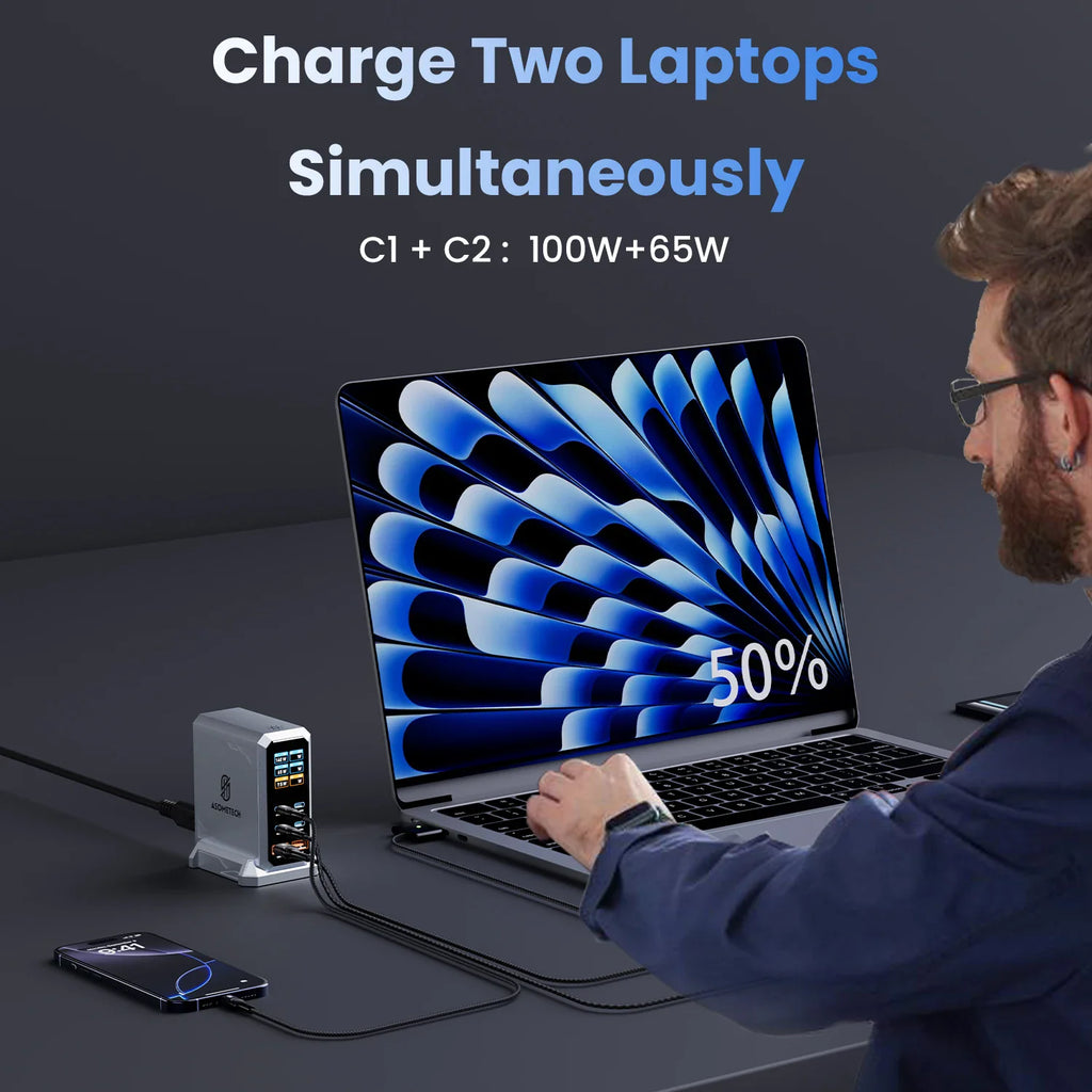 A person charging a laptop using a 240W desktop power station