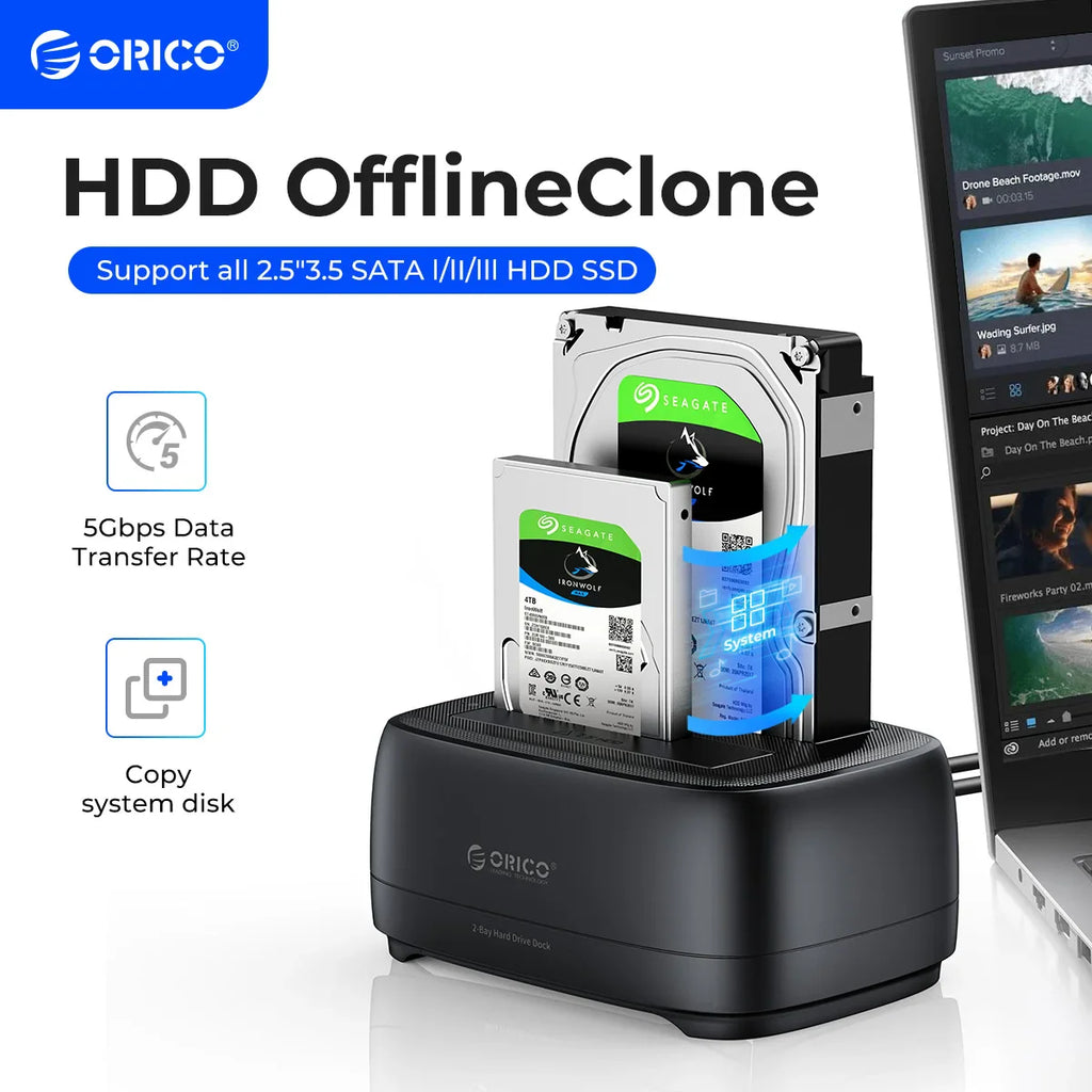 Dual bay hard drive docking station with two hard drives inserted, connected to a laptop
