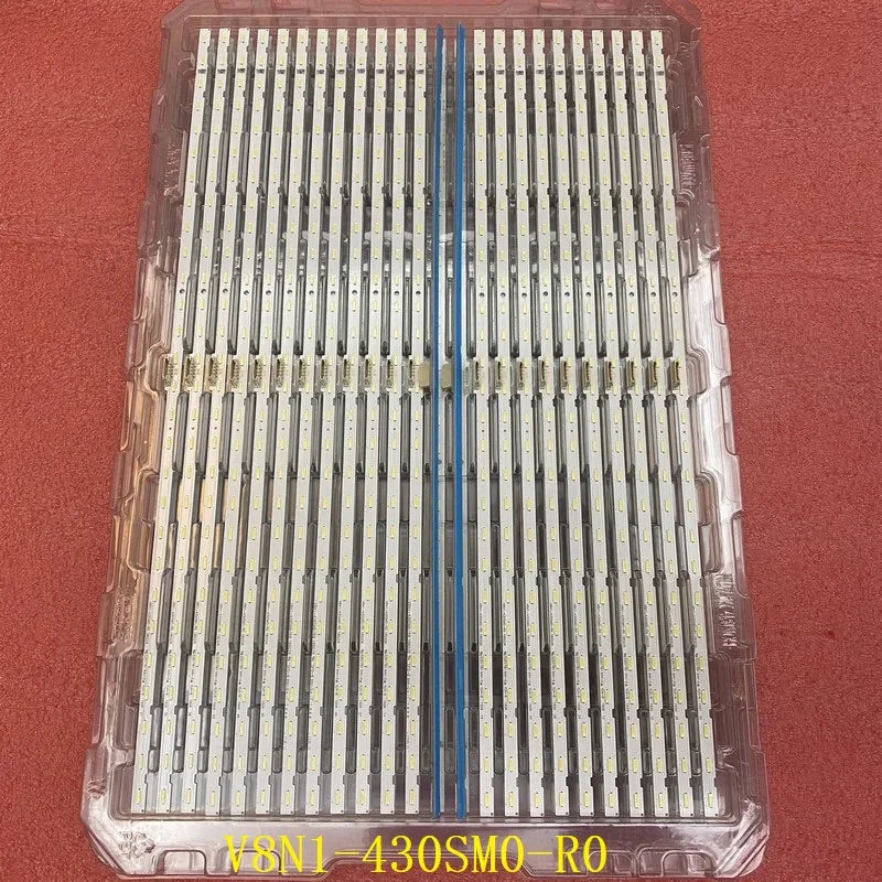 A bulk package containing multiple rows of LED backlight strips in a clear plastic tray