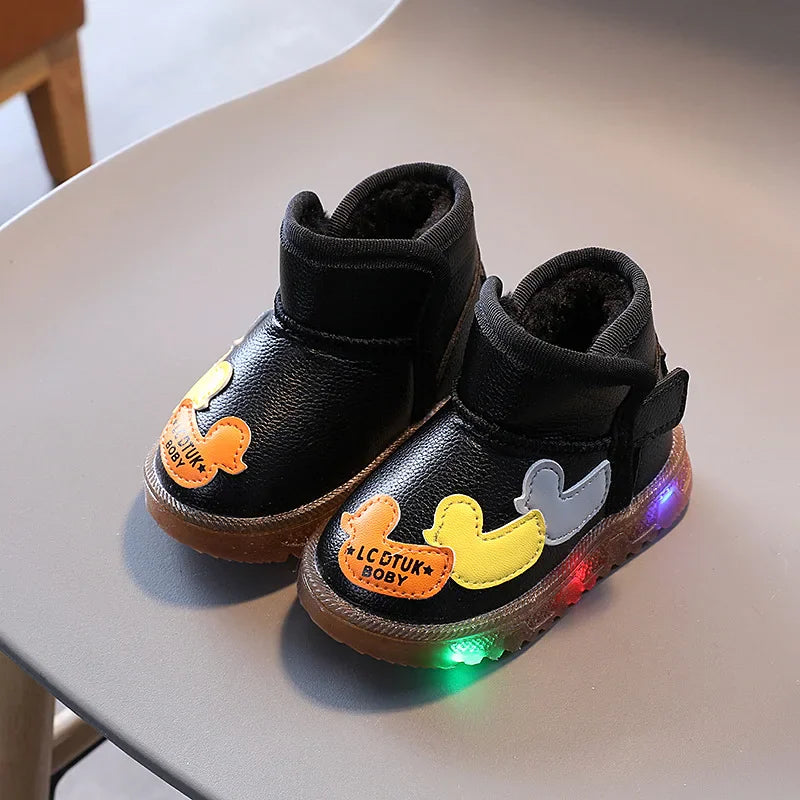 Pair of black toddler winter boots with fleece lining, duck appliques, and light-up soles