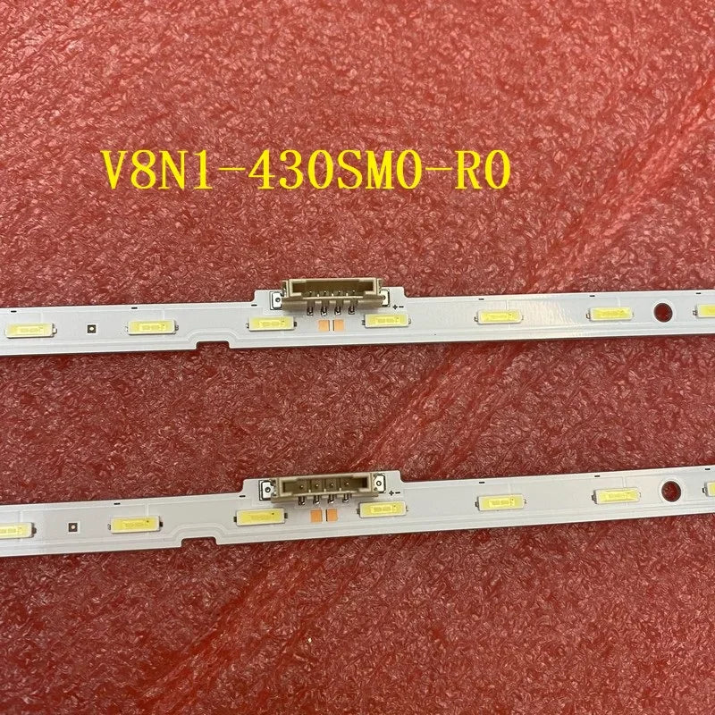 Close-up view of the central power connectors on two LED backlight strips