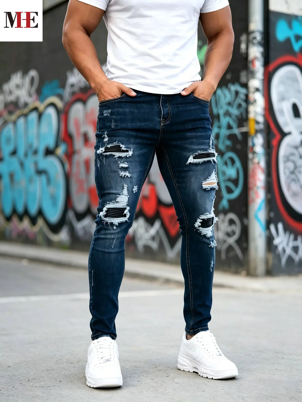 Dark blue slim skinny jeans with black stripe patches, front view