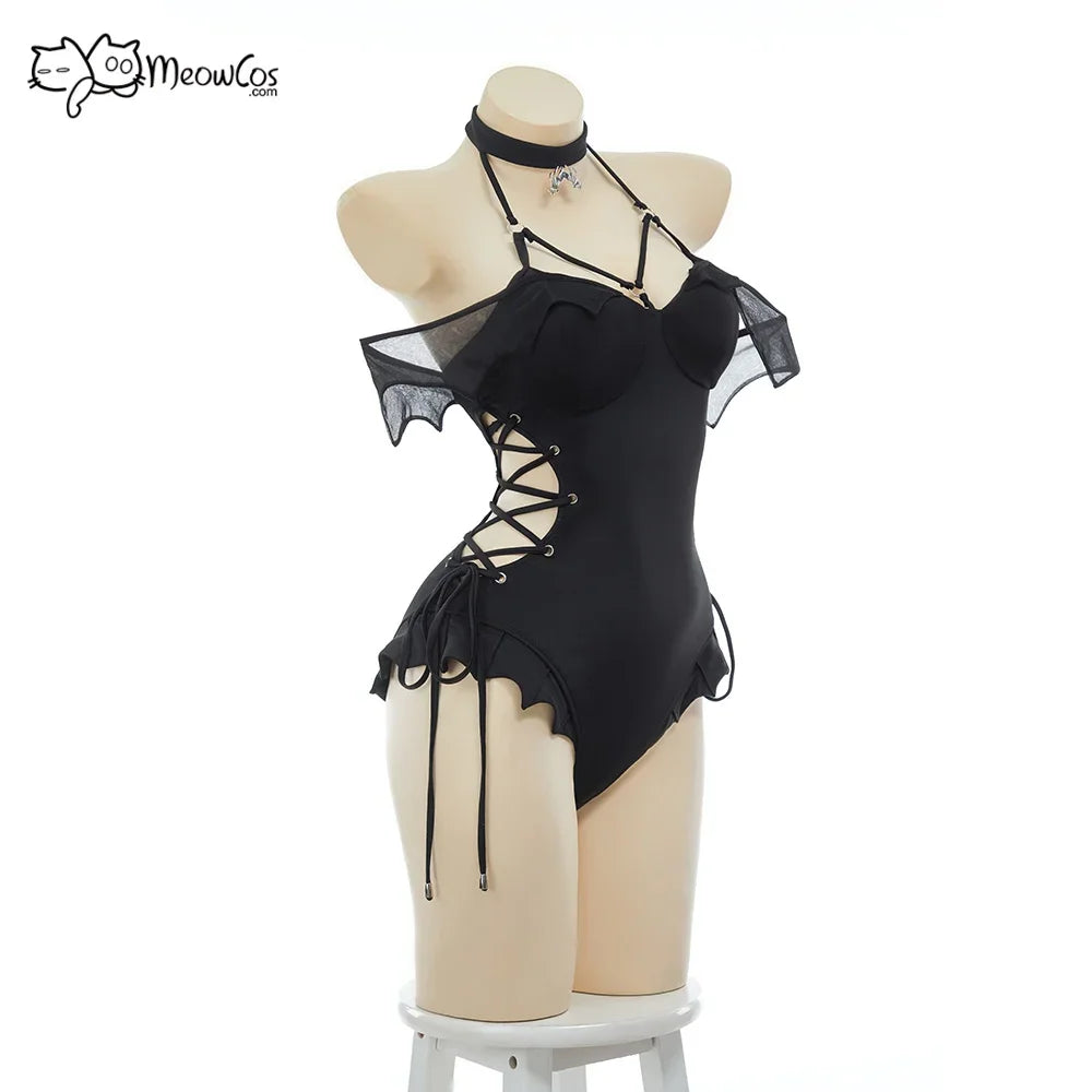 Mannequin wearing a black gothic swimsuit with bat wing accents and side lacing