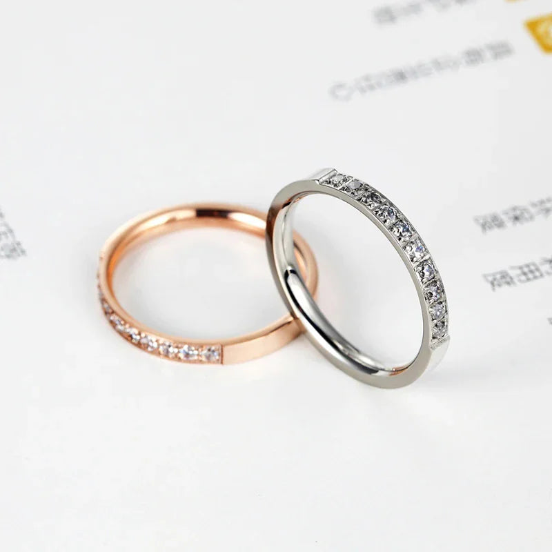 Rose gold and silver tone band rings with inlaid crystals