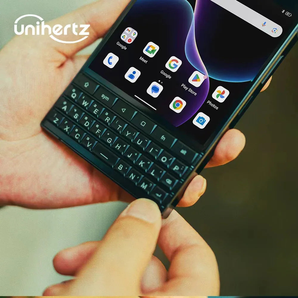 Person holding black smartphone with physical QWERTY keyboard