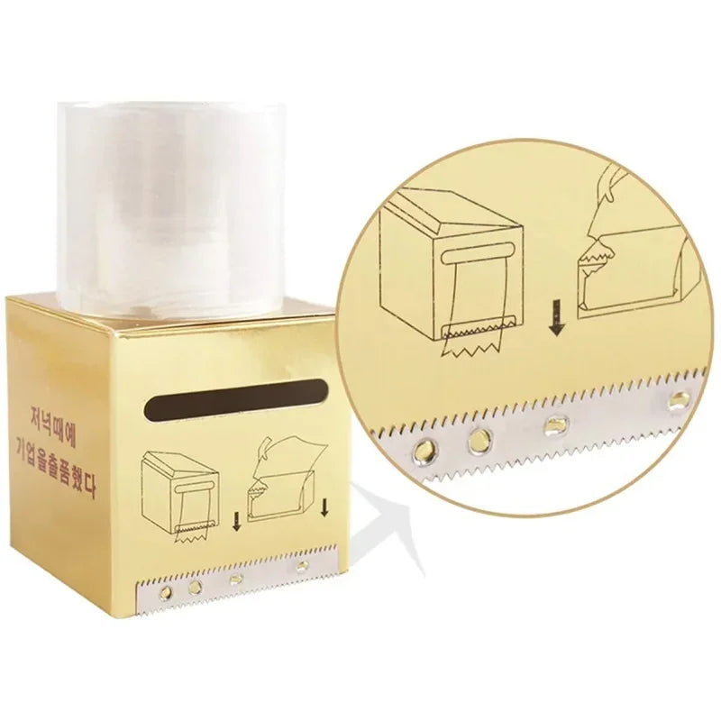 Instructional view of how to load a roll of preservative film into a gold dispenser box