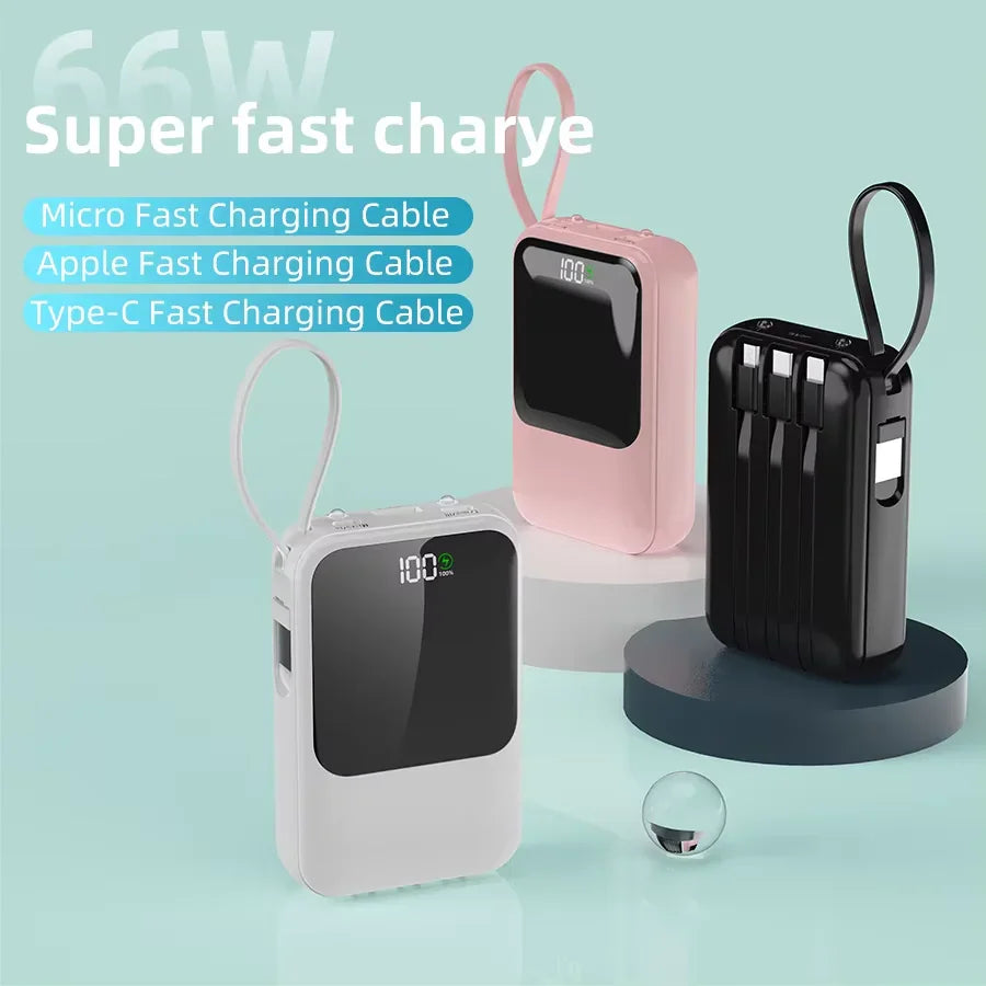 Three portable power banks in white, pink, and black, displaying digital battery levels.