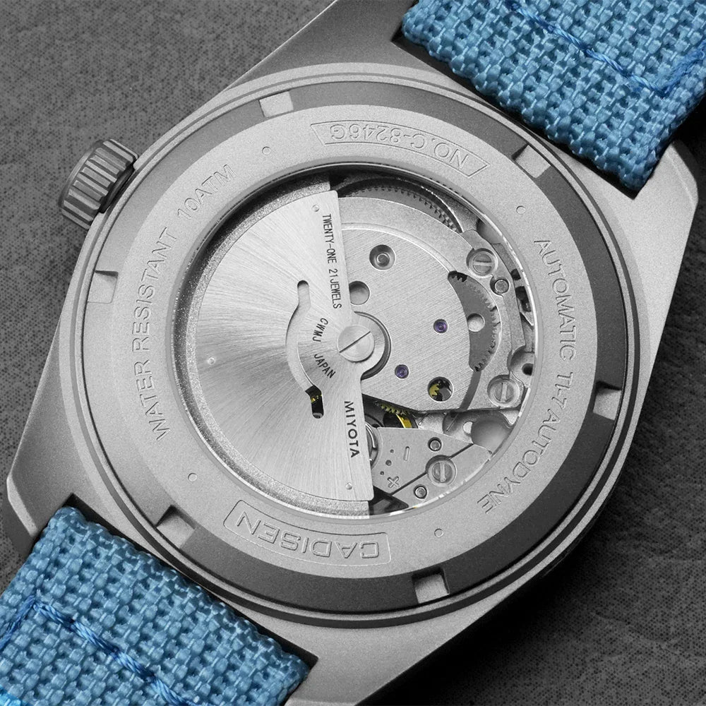 Back view of titanium mechanical watch with exhibition case back showing automatic movement
