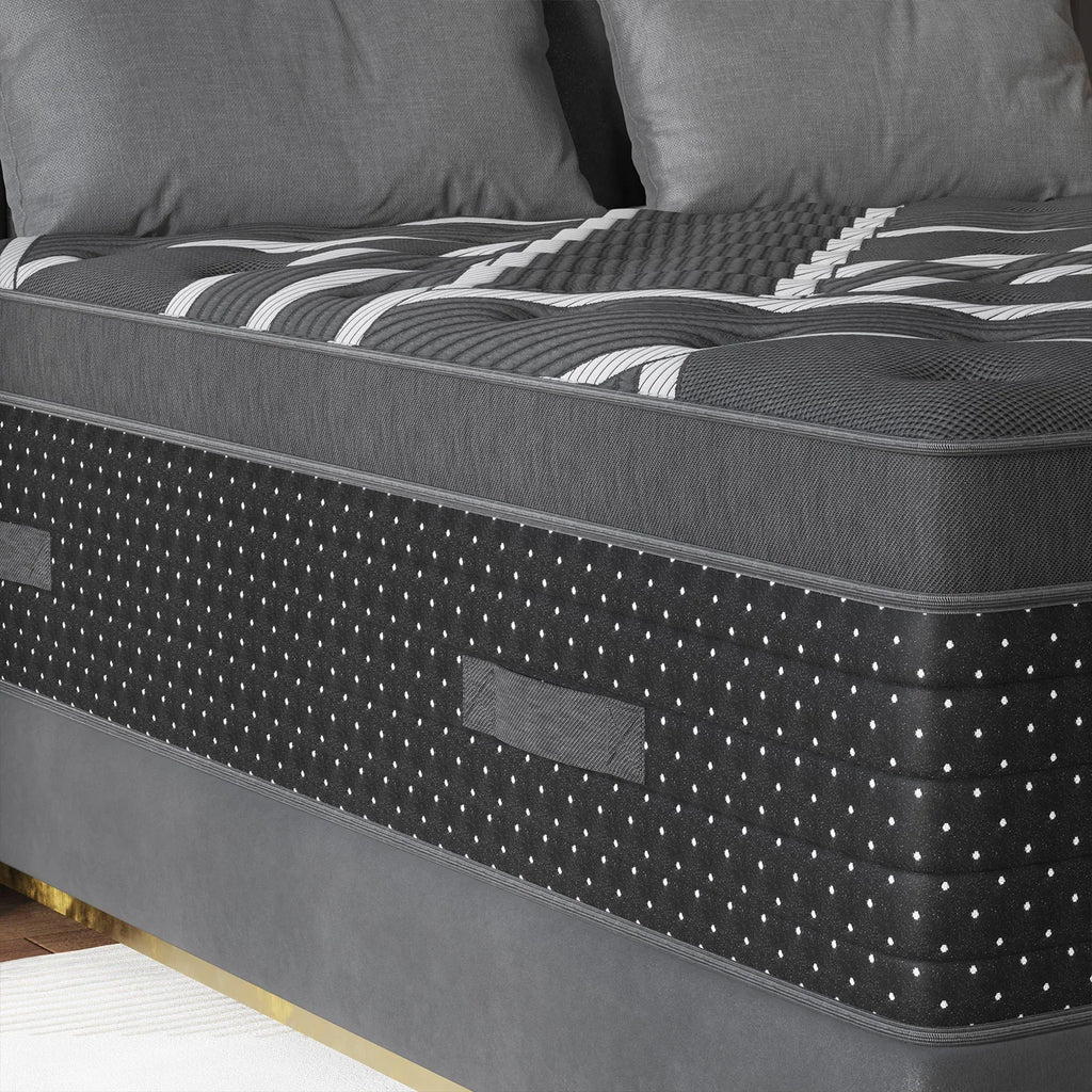 Close-up of the grey and black hybrid mattress surface and side panel