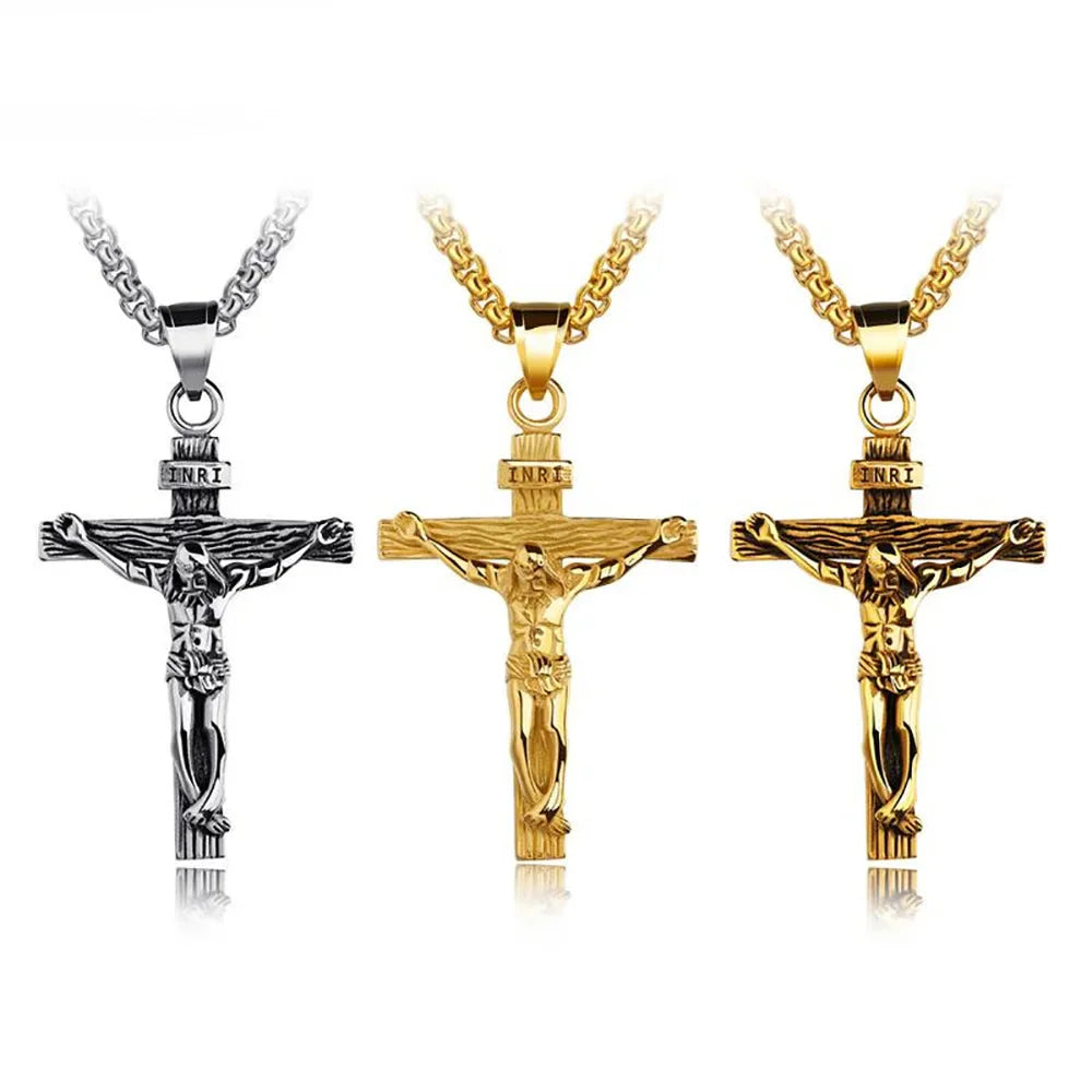 Set of three crucifix pendant necklaces in silver and gold colors