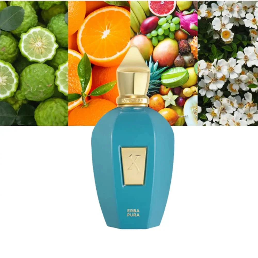 A turquoise perfume bottle surrounded by various fresh fruits including oranges and limes.