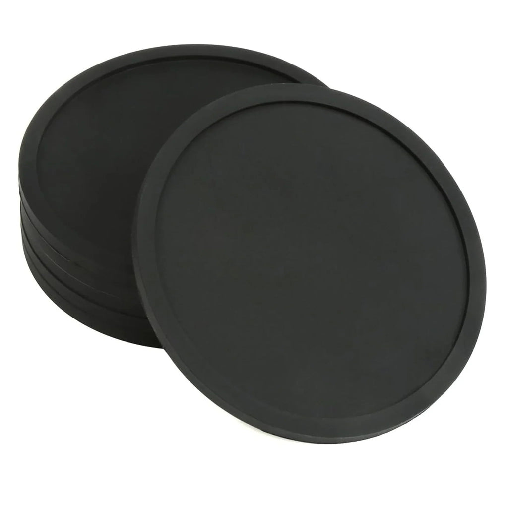 Stacked round black silicone drink coasters