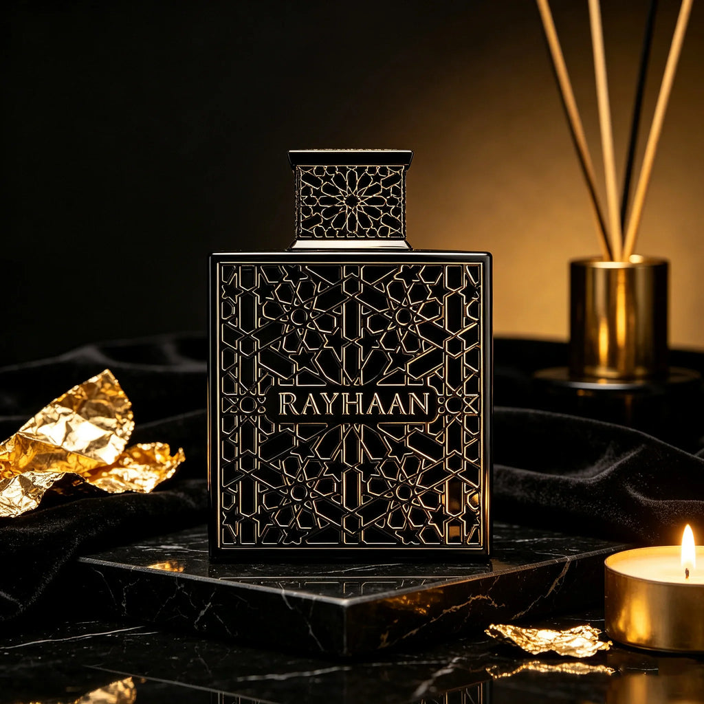 Black rectangular perfume bottle with intricate geometric gold-toned pattern and matching cap on a marble base with candle