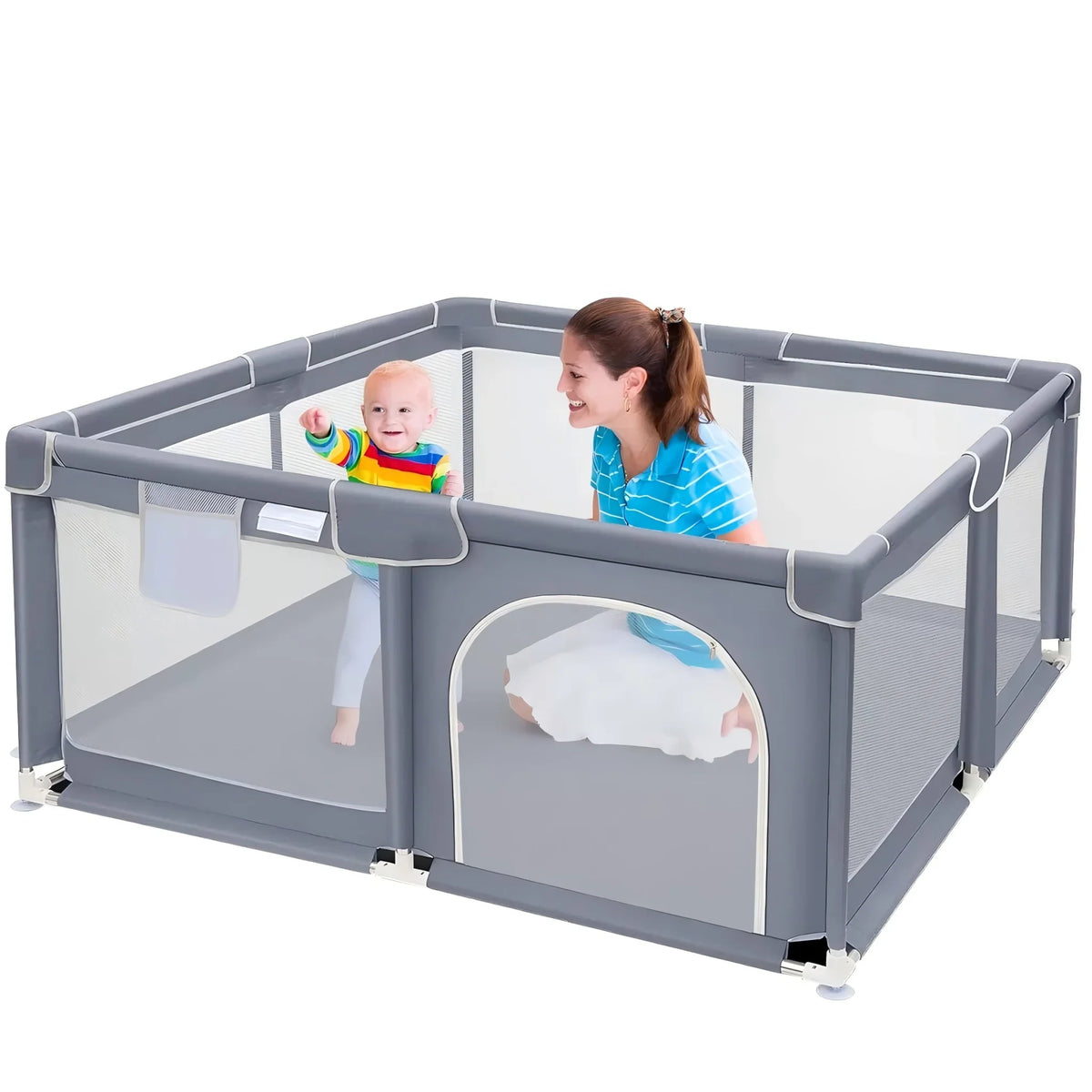 A grey baby playpen with mesh walls and a zippered side gate in a room, featuring a mother and baby inside