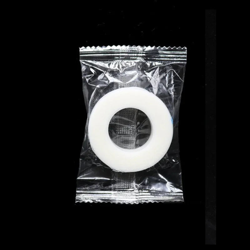 Roll of transparent micropore tape for eyelash extensions in plastic packaging