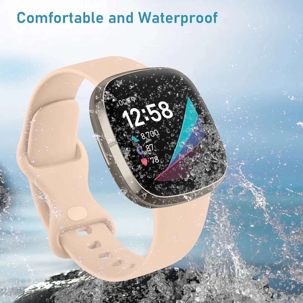 A light pink silicone smartwatch band shown against a watery background to demonstrate water resistance.