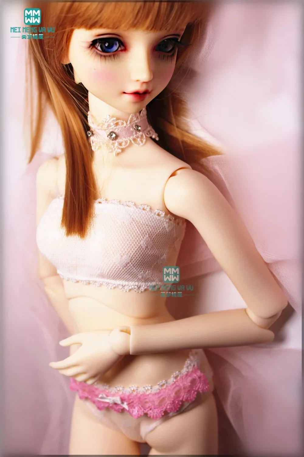 A BJD doll wearing a white lace tube top and pink lace briefs