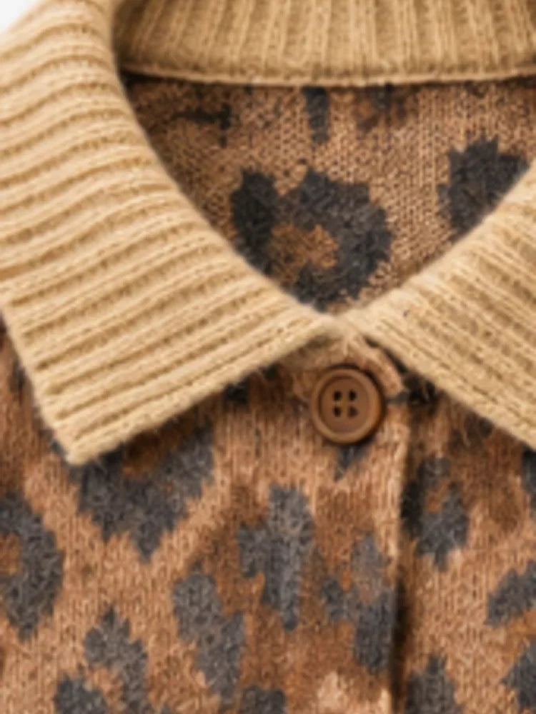 Close up of the yellow collar and button detail on a leopard print knit cardigan