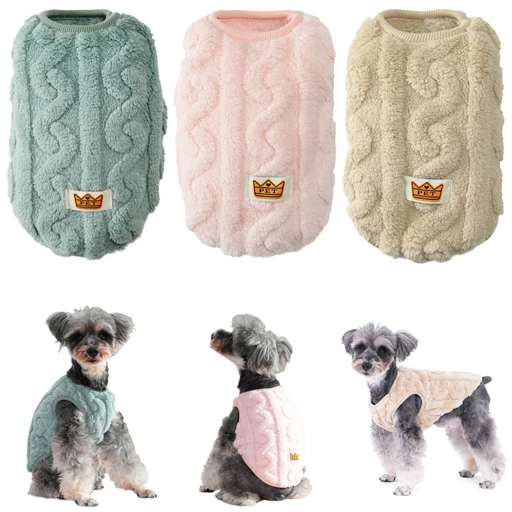 Green, pink, and beige fleece dog sweaters with a crown patch.