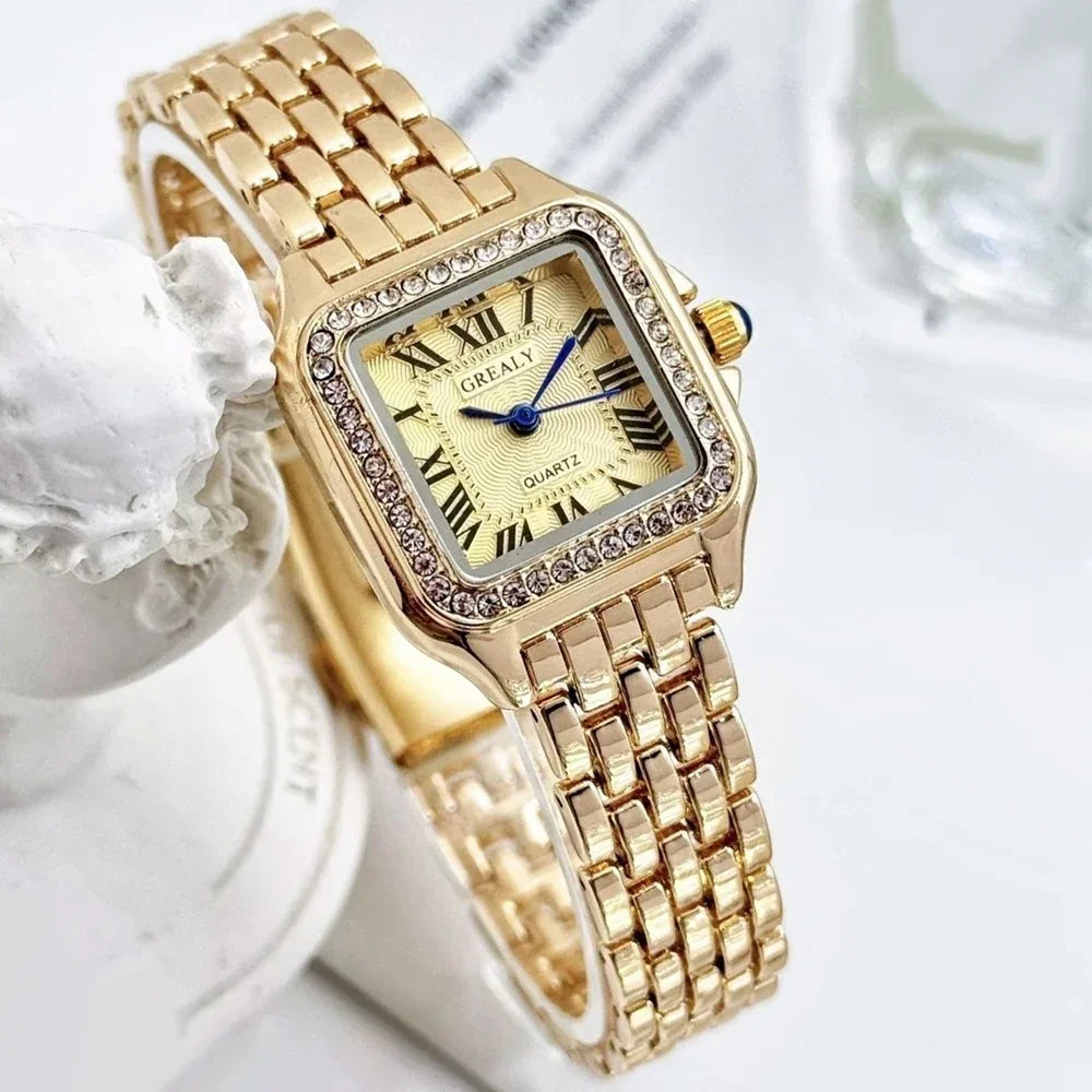 Gold square quartz watch with a rhinestone-encrusted bezel and a gold metal link strap