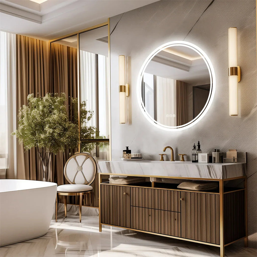 Round backlit LED mirror above a vanity with two side wall sconces