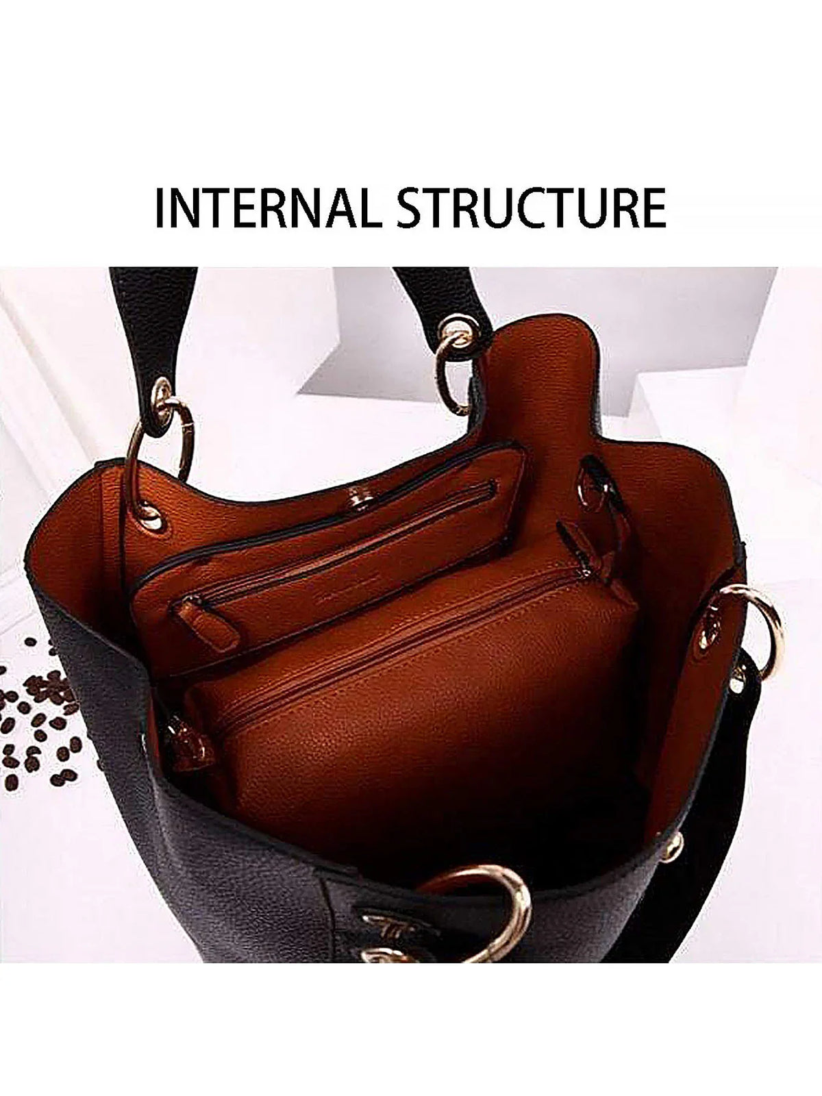 Interior of a black and tan tote bag showing zipper pockets and structure