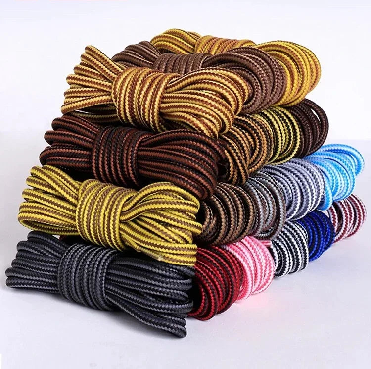 Stacked pile of various coloured striped shoelaces