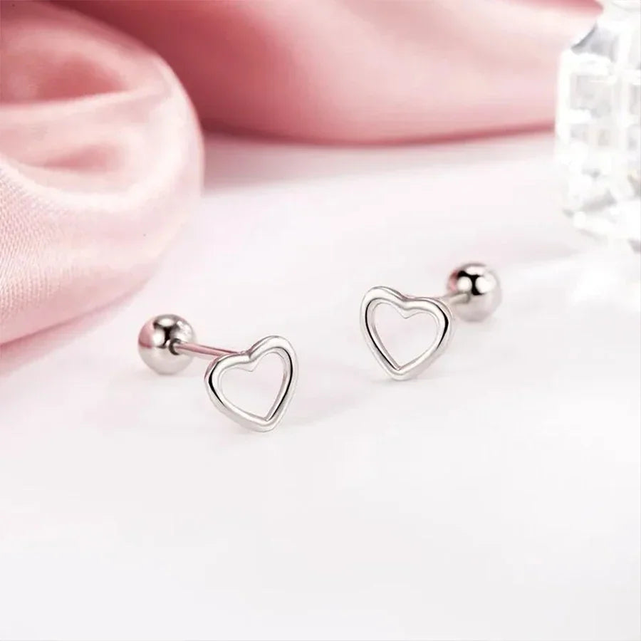 A pair of silver heart-shaped stud earrings
