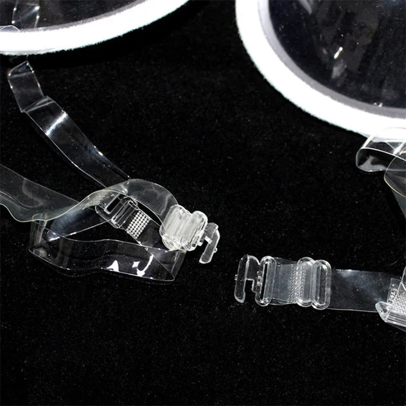 Close-up of the clear plastic strap and hook closure for a bra.