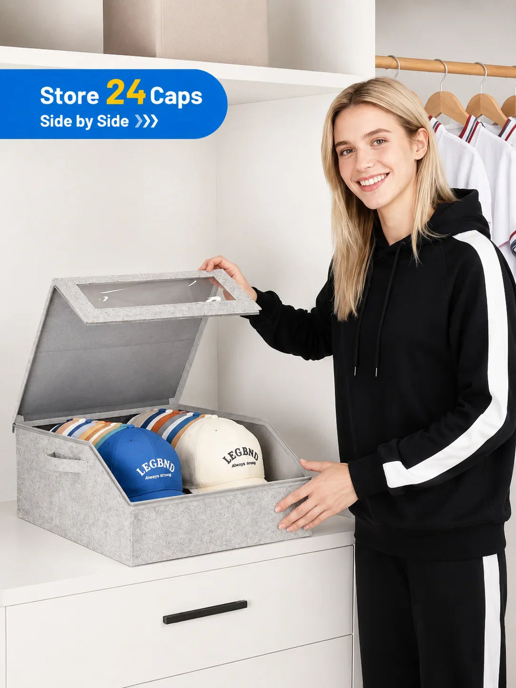 A woman holding the lid of a grey felt storage box for baseball caps