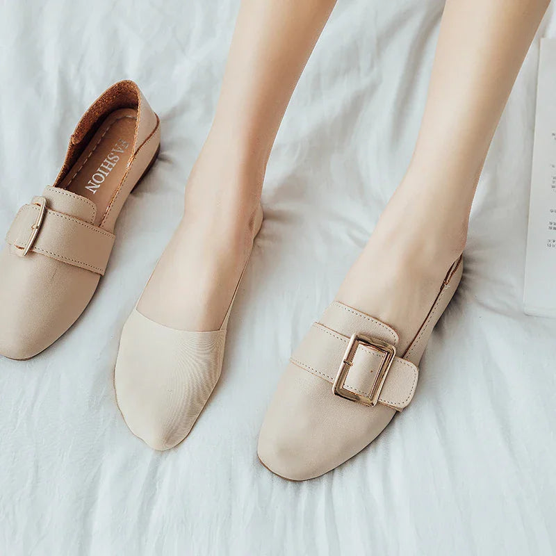 Beige invisible low-cut liner sock being worn with beige buckled slip-on flats