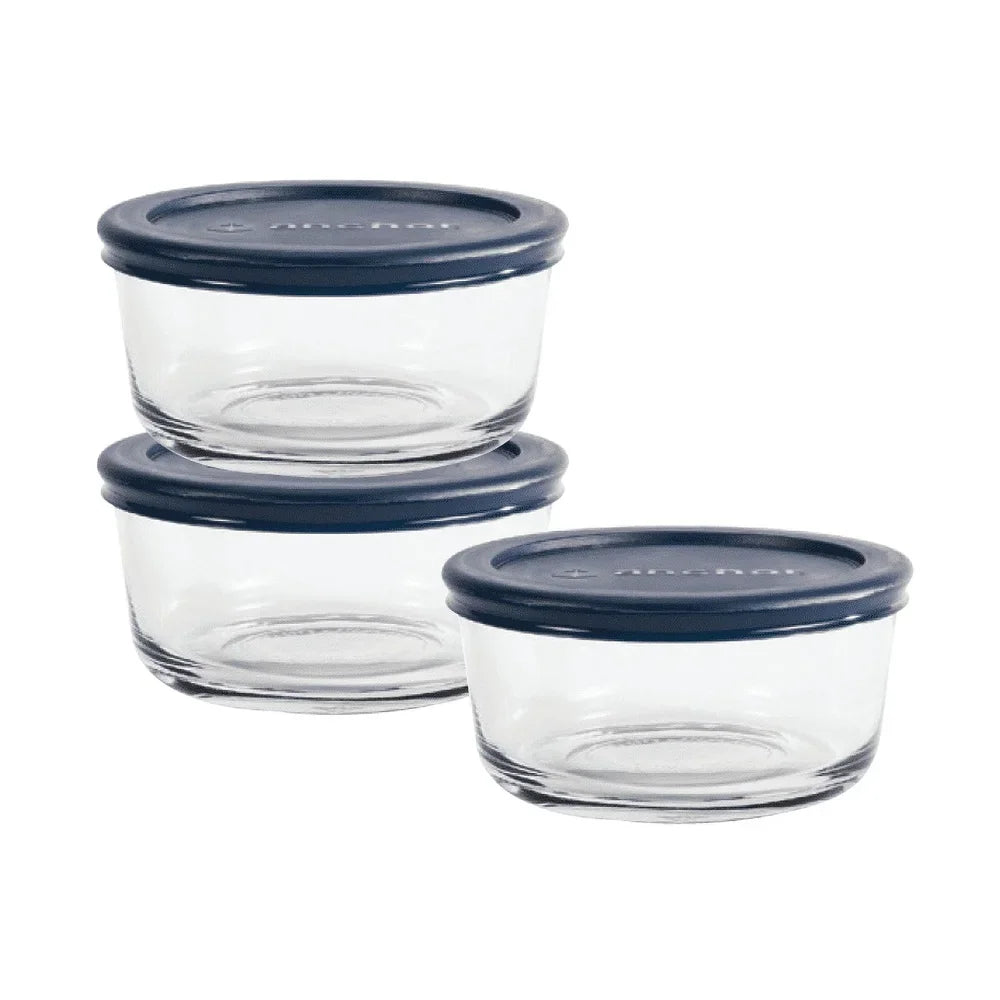 Set of three round glass food storage containers with blue lids