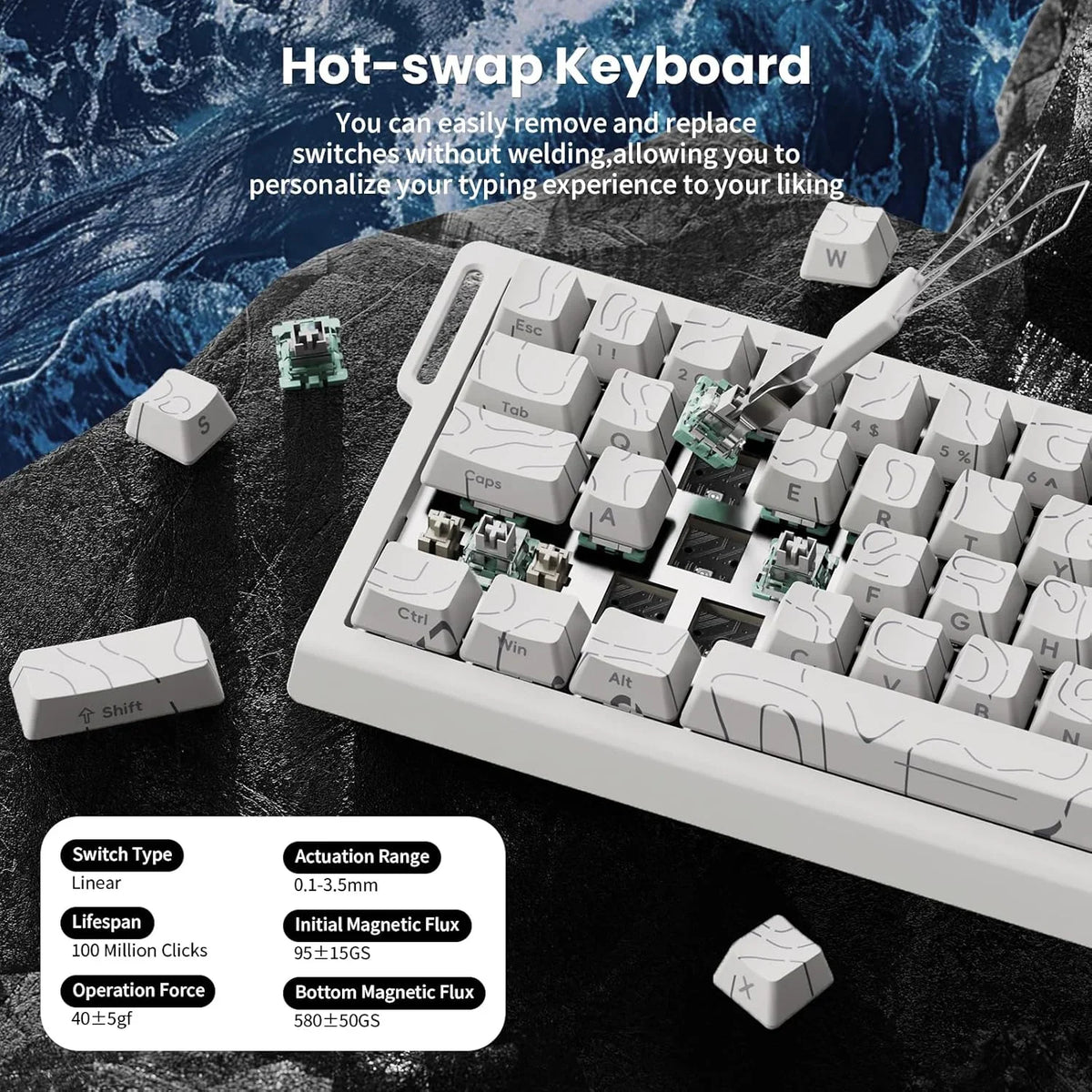 Close up of a white mechanical gaming keyboard with hot swappable magnetic switches and a keycap puller.
