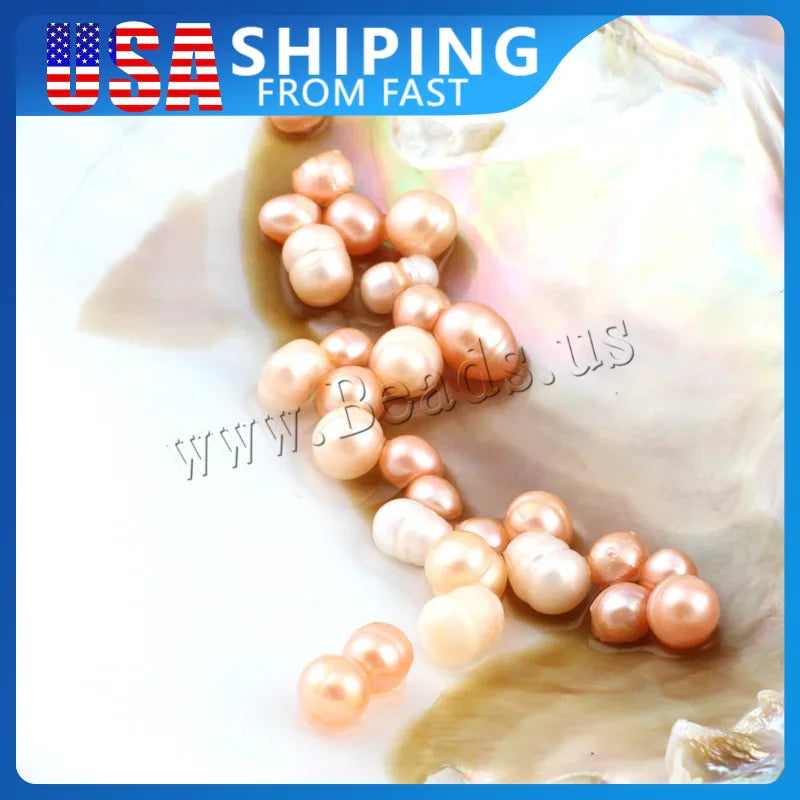 A collection of loose pink and white freshwater cultured pearls