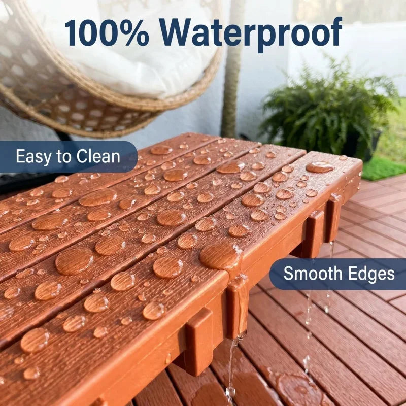 Waterproof red plastic deck tiles with water droplets on the surface