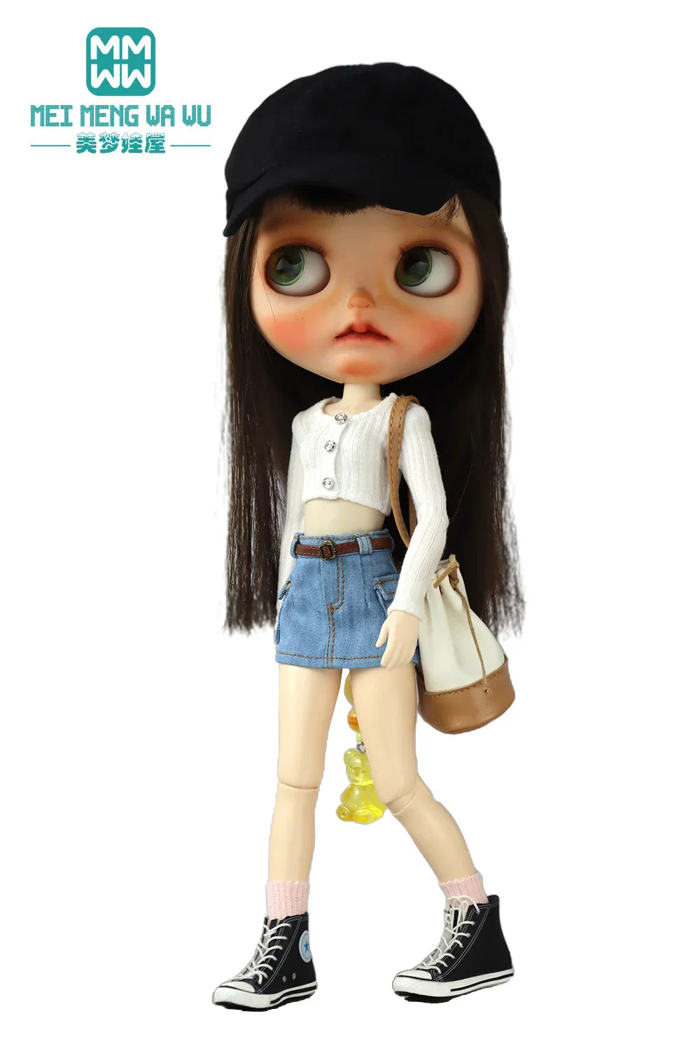 Doll in a black cap, white long sleeve cropped knit top, denim miniskirt and bag